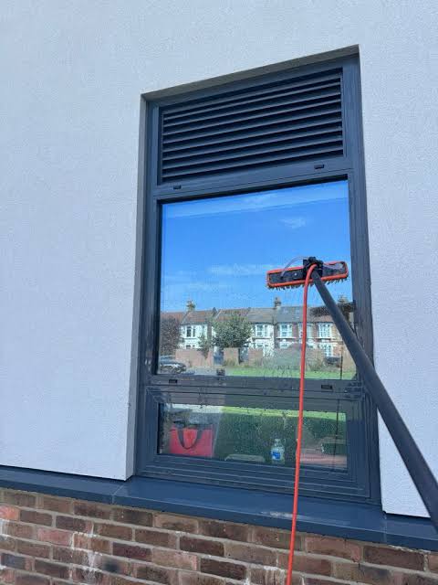 Water-fed pole window cleaning on an office building